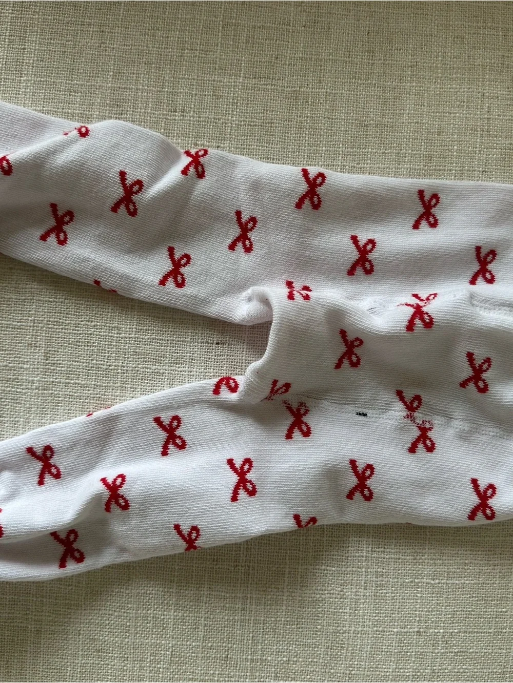 Rufflebutts White Baby/Toddler Footed Tights with Red Bow Pattern
